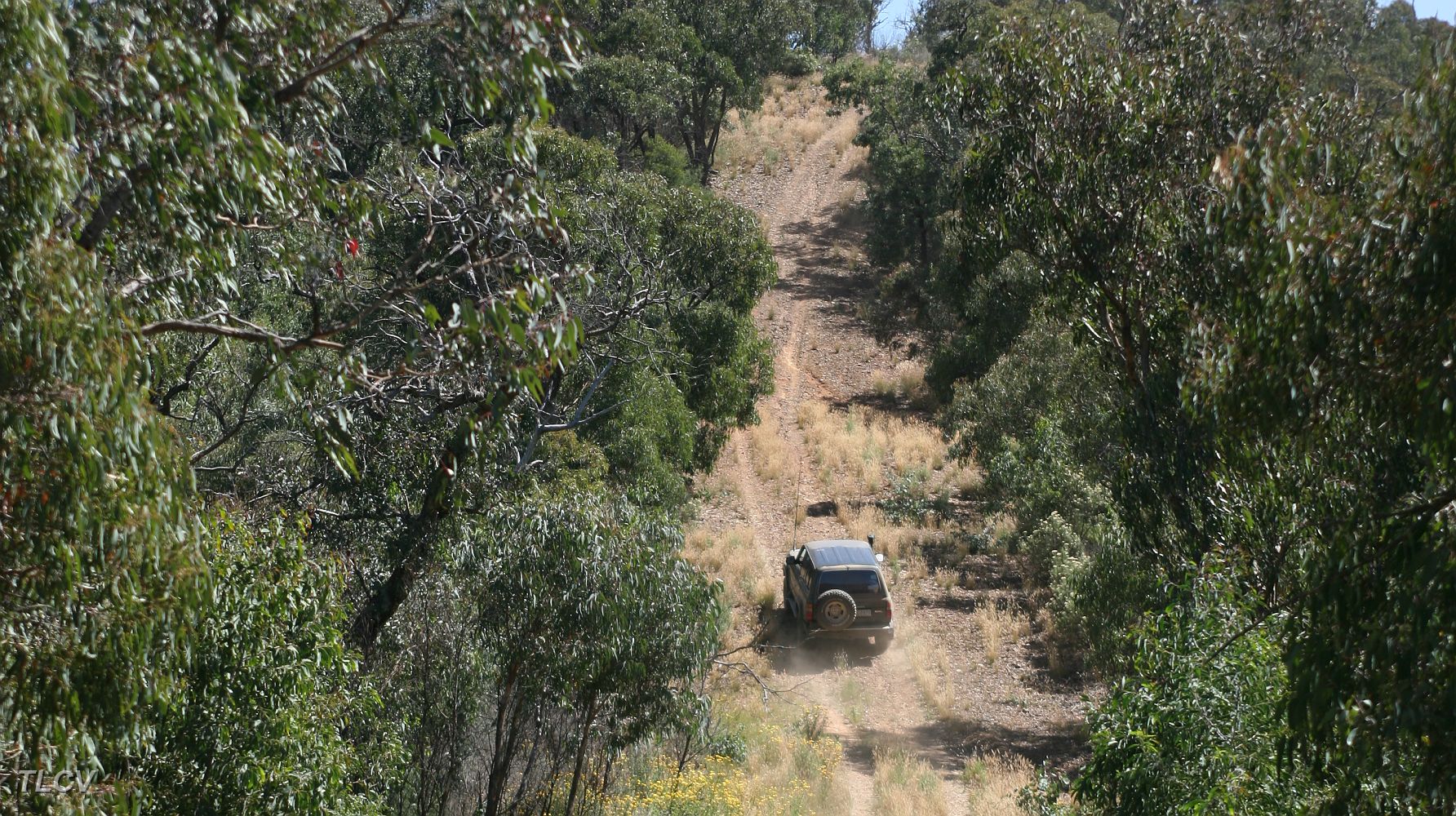 19-Iceman creates dust climbing WC1 track.JPG